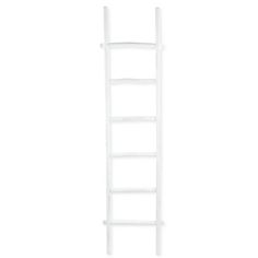 a white ladder leaning up against a wall