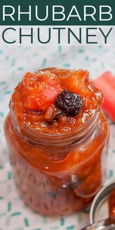 a jar filled with fruit sitting on top of a table