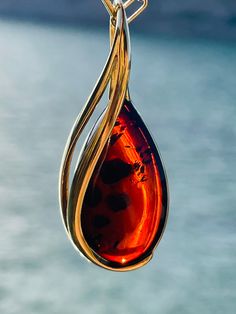 Elegant Luxury Amber Necklaces, Luxury Gold Necklace With Baltic Amber, Luxury Elegant Amber Necklaces, Polished Teardrop Amber Necklace, Amber Teardrop Necklace With Polished Finish, Donut Shape, Amber Pendant, Amber Necklace, Pendant Silver