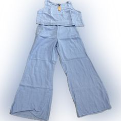 Women’s 2pc Pants Suite. Wide Legs. Sleeveless. Light Blue. Large. Casual Sleeveless Matching Set Bottoms, Casual Matching Set Bottoms, Casual Wide Leg Two-piece Bottoms Set, Casual Two-piece Set With Wide Leg Bottoms, Casual Wide-leg Two-piece Bottoms Set, Casual Light Blue Sets With Pockets, Light Blue Casual Sets For Vacation, Casual Light Blue Sets For Vacation, Casual Two-piece Pant Set For Vacation