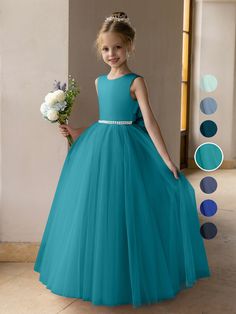 This elegant Lavetir flower girl dress is perfect for a first communion party, wedding, or any special occasion. The satin bodice and puffy tulle skirt create a light, graceful silhouette. Available in four styles: scoop neckline with high back, scoop neckline with V-back, V-neckline with high back, and V-neckline with V-back. The back features a charming satin bow, and the waist is adorned with two rows of pearls for an added touch of sophistication. Combining comfort and style, this dress will Flower Girl Dresses Teal, Dresses With Pearls, Puffy Tulle Skirt, Kids Prom Dresses, Colorful Gown, Flower Girl Dresses Blue, Tulle Balls, Wedding Colours, Princess Flower Girl Dresses