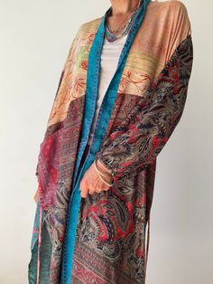 "This is one of a kind patchwork, upcycled silk robe Made free size with wrap tie closing and short sleeves Easy and fun to wear around the house or outside as a urban boho style, flowy kardigan with jeans and tshirt It is very comfy and feels soft and light the material is colourful indian saree silk made into this unique stylish over all MEAESURE free size length 38\" MATERIAL *saree silk, no lining More ideas at https://www.etsy.com/shop/AltheaStores? CARE INSTRUCTIONS * Wash in warm water * Urban Boho, House Coat, Saree Silk, Kimono Wrap, Silk Robe, Indian Saree, Womens Robes, Silk Kimono, T Shirt And Jeans