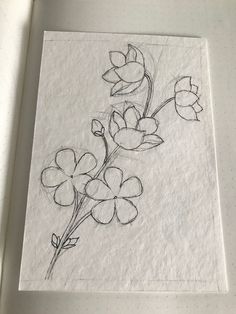 a drawing of some flowers on a piece of paper