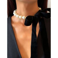 This unique faux pearl necklace is an eye catching beauty that will staple your elegant style. Perfect to complete a glamorous look. Features: Faux Pearl with Velvet self tie. Size: Line of pearls - 21.5", Velvet tie 7.75" Color: Ivory/Black Velvet Tie, Pearl Accessories, Ribbon Necklace, Handmade Fashion Jewelry, Popular Jewelry, Faux Pearl Necklace, 가을 패션, Girly Jewelry, Pearl Choker