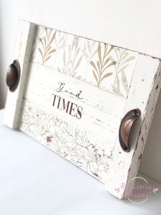 a white wooden sign with words and flowers on it that says love times in brown lettering