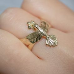 The Hummingbird represents wisdom and courage due to the long journeys it takes during the migration year. This ring is a hummingbird literally 'hugging' your finger, reminding you daily of its message to move forward with confidence and grace. CUSTOMIZATION AND FONTS * Usually Gothic letters are preferred for this ring, but I can place any type of design or font. * This ring can be customized with any letter (provided it fits) and is made in solid gold. I recommend a single letter for this ring Gold Gothic Jewelry, Hummingbird Ring, Bird Fairy, Gothic Letters, Bird Ring, Jewelry Board, Special Symbols, Ring Flower, Signet Rings