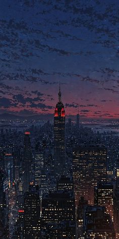 the empire building is lit up in red and white at night, as seen from top of the rock