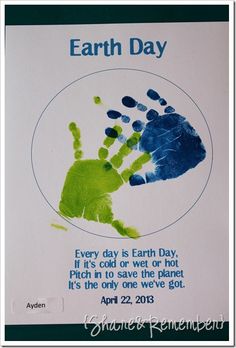 an earth day poster with handprints on it