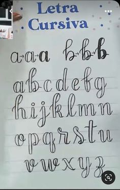 there is a handwritten alphabet written in cursive writing on a piece of paper