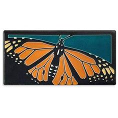 an orange and black butterfly on a blue background