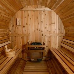 the inside of a sauna with wooden walls