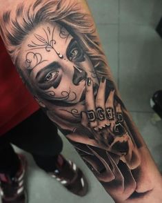 a man's arm with a tattoo on it and the image of a clown