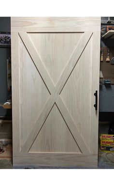 an unfinished wooden door is shown in the process of being made and installed into a cabinet