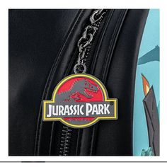 Step into the adventurous world of Jurassic Park with this vibrant anime-themed backpack. Perfect for fans of the iconic movie series, this backpack combines practicality with an eye-catching design, ideal for daily use, school, or travel. Material: Made from durable PU material, ensuring longevity and resilience. Special Features: Features a spacious main compartment, a front zipper pocket, and adjustable padded shoulder straps for comfort. Technical Specifications: Dimensions are 27 cm in heig Themed Backpack For Cosplay, Disney Backpack For Theme Park And Back To School, Disney Themed Standard Backpack For Theme Park, Themed Backpack For Theme Park, Themed Standard Backpack For Theme Park, Back To School Backpack For Theme Park, Disney Backpack For School With Case Included, Disney Backpack With Case For School, Themed Black Backpack For Theme Parks