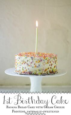 a birthday cake with white frosting and sprinkles is on a plate