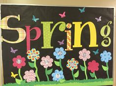 a bulletin board with the word spring written in large letters and flowers on it's side