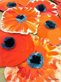 paper plate poppys that are painted orange and blue