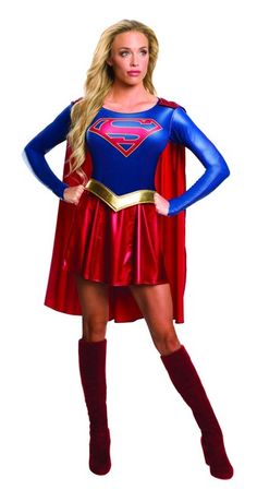 a woman dressed as a supergirl standing with her hands on her hips while wearing a red and blue costume