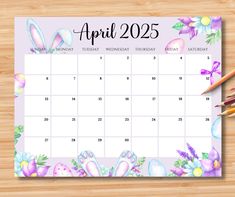 a calendar with pencils on top of it and an image of easter eggs in the background