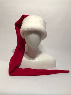 Santa Hat with extra long tail and super wide brim. Perfect for getting your ho ho ho on. Tail can be wrapped around neck to keep off the chill. Made of high quilt super soft fleece. Every hat is handmade. Sizes available are: Adult: 22-24 inches Head circumference Youth: 21-23 inches Child: 19-22 inches Toddler: 18-20 inches Other color combos are available . . . please message me. Thanks! Go Dog Go, Philly Eagles, Christmas Gift List, Cat Hat, Long Tail, Ho Ho Ho, Santa Hat, Wide Brimmed, Blue Dress