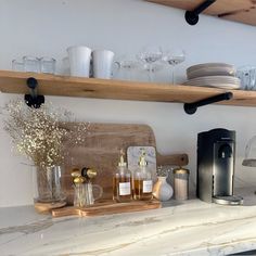 the kitchen counter is clean and ready to be used for dishes, cups, and other things