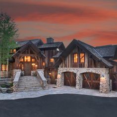 a large home with stone and wood accents