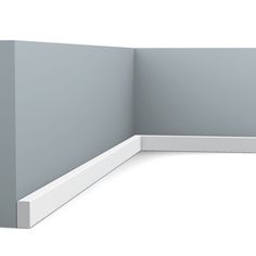 an empty corner wall with a white base