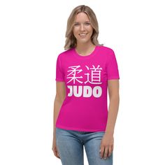 a woman wearing a pink t - shirt with the words judo written in chinese