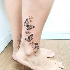 a woman's legs with butterflies and words on the bottom of their ankles,