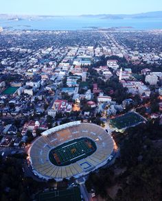 an aerial view of a stadium and the city