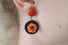 Vibrant orange flower earrings, Clay earrings, Dark blue and orange dangle polymer clay earrings, Statement earrings ▲Currently, the preparation time is 4-6 weeks. After that, I can ship the orders. FEDEX priority shipping takes: 2-3 WORKDAYS ( USA ). These are unique, handmade, polymer clay earrings with spring orange flower motifs. These beautiful earrings are pieces of original and unique artwork. The method is known as 'appliqued technique'. Using tiny pieces of clays and a sharp needle. I d Handmade Orange Dangle Flower Earrings, Handmade Polymer Clay Flower Earrings For Gift, Hand Painted Orange Earrings As Gift, Orange Dangle Earrings Polymer Clay, Orange Dangle Earrings In Polymer Clay, Orange Dangle Polymer Clay Earrings, Orange Dangle Polymer Clay Jewelry, Orange Polymer Clay Dangle Jewelry, Orange Polymer Clay Dangle Earrings