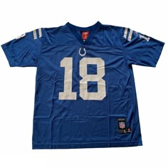 "Vintage 2000s Reebok NFL Indianapolis Colts #18 Peyton Manning Football Jersey YOUTH Size Large Condition: This jersey is in good pre-owned condition with some wear on the back number 1 as seen in the photos. Material: Shell: 100% Nylon Knit Trim: 100% Polyester Size: YOUTH Size Large Please refer to measurements for exact fit. Measures: Chest (armpit to armpit): 19\" Sleeve (shoulder to sleeve end): 9\" Length (back neck seam to bottom): 23\" Note: Pre-owned items may have minor imperfections, Cheap Football Season Jersey, Affordable Fitted Crew Neck Baseball Jersey, Blue Football Jersey, Blue Football, Peyton Manning, Vintage Jerseys, Vintage 2000s, Indianapolis Colts, Football Jersey