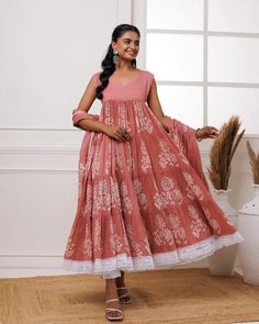 This coral mul-mul anarkali set is perfect for adding a pop of color to any occasion. Hand block printed for an exquisite finish, it features delicate lace work and a matching dupatta adorned with tassels. Crafted for both elegance and comfort, this set is the perfect addition to your wardrobe. No. of pieces - 3 piece set. Color - Coral. Fabric - Mul-Mul. Washing Instructions - Dry Clean. Designer Pink Palazzo Set With Bandhani Print, Designer Wear Pink Palazzo Set With Bandhani Print, Bohemian Block Print Anarkali Set For Wedding, Designer Wear Anarkali Set With Block Print, Pink Block Print Unstitched Anarkali Set, Pink Anarkali Block Print Palazzo Set, Pink Block Print Anarkali Set, Bohemian Pink Anarkali Set With Printed Motifs, Pink Anarkali Set With Block Print