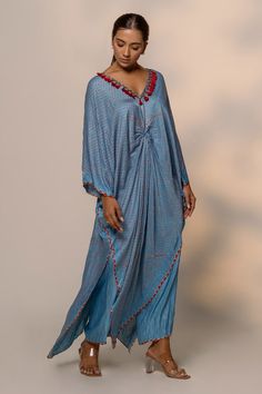 Sky blue printed kurta with front knot paired and has handmade tassels, metal detailing on the neckline. Paired with straight palazzo pant. - Aza Fashions Blue Printed Kaftan For Summer, Blue Kaftan With Printed Motifs For Summer, Blue Kaftan For Spring Festive Occasions, Blue Traditional Drape Kurta For Summer, Blue Silk Kaftan For Festival, Blue Silk Kurta For Summer, Blue Bohemian Kaftan With Traditional Drape, Blue Spring Festive Kaftan, Blue Bohemian Kurta With Traditional Drape