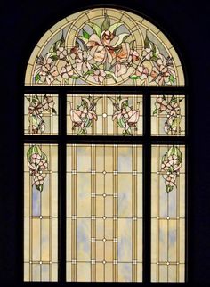 a stained glass window with flowers on it