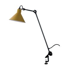 a lamp that is on top of a white wall and has a black arm with a yellow shade