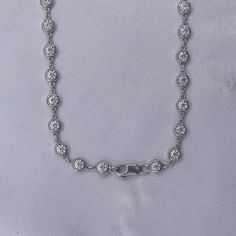 This exquisite 3 3/4 Carat round moissanite diamond necklace features a delicate link chain and a bezel-set design. Expertly crafted with lab-created diamonds in 10K or 14K solid gold and 925 sterling silver, this piece radiates luxury and sophistication. The perfect addition to elevate any outfit. Model No : CSSN1523 Link Chain Necklace, Round Moissanite, Moissanite Diamonds, Chain Link Necklace, Lab Created Diamonds, Diamond Clarity, Set Design, Bezel Setting, Link Chain