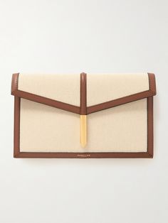 DeMellier's 'Tokyo' clutch has been expertly crafted in Spain from canvas in an envelope silhouette outlined with smooth leather. It fastens with the signature arrow-shaped hardware and has just enough space inside for your cards, lipstick, keys, and phone. Attach the chain shoulder strap to go hands-free. Beige Clutch With Magnetic Closure For Formal Events, Classic Tan Clutch For Formal Occasions, Formal Beige Clutch With Magnetic Closure, Formal Clutch With Leather Handles, Elegant Formal Clutch With Leather Handles, Formal Tan Leather Clutch, Elegant Tan Leather Clutch, Luxury Clutch With Leather Handles, Designer Rectangular Woven Leather Clutch