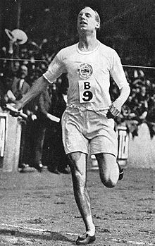 an old photo of a man running in the dirt