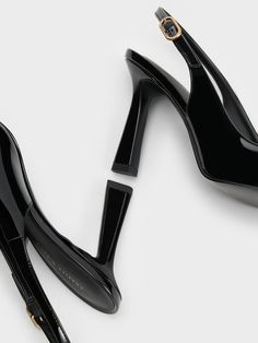 Step into any room with confidence in these patent slingback pumps. The sleek pointed-toed silhouette and high-shine black finish effortlessly exudes sophistication and poise. Perched on elegant 9cm trapeze heels, these shoes will elongate your frame for a flattering leg-lengthening effect - perfect when paired with sharp pantsuits. With adjustable slingback straps for a custom fit, these shoes are your best bet for an instant confidence booster. Confidence Boosters, Slingback Pump, Black Pumps, Custom Fit, Sleek, Pumps, Confidence, Heels, Frame