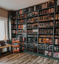 a room filled with lots of books on shelves