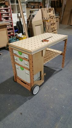 a workbench made out of plywood with drawers