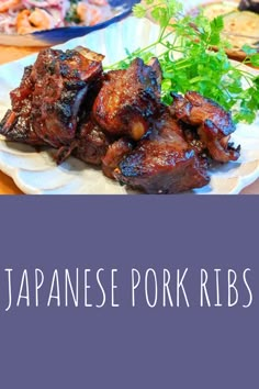 japanese pork ribs on a plate with garnishes