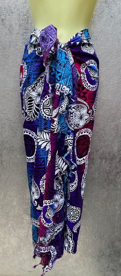 "Hawaiian Floral & Tribal Sarong/Pareu, Pareo Or Tupenu. Beach Wear, Luau Sarong, Cover - This is a Rayon sarong. Perfect for the beach or Luau. Measurement- Approximately 62\" x 44\" with fringe. This sarong tend to go pretty fast so get it while you can. NOTE- The actual color may vary slightly from what you see, due to differences in how monitors display the colors. Guaranteed fast shipping! :)" Ie Lavalava, Bohemian Sarong With Traditional Patterns For Beach, Blue Bohemian Sarong With Traditional Patterns, Bohemian Sarong With Traditional Patterns For Festival, Multicolor Traditional Sarong For Beach, Polynesian People, Hawaiian Men, Beach Sarong, Women's Cover Up