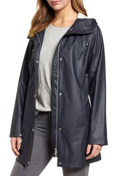 Designed in Scandinavia, this classic slicker will keep you dry and comfortable during storms and showers with its waterproof finish and drawcord hood. 32" length (size 34) Front snap closure Drawcord hood Long sleeves Front slash pockets Lined 100% polyurethane with 100% polyester contrast Machine wash, line dry Imported Coats Classic Waterproof Raincoat For Fall, Fall Travel Raincoat With Storm Flap, Classic Outerwear For Rainy Weather, Double-lined Hood Parka For Rainy Season, Rain Season Parka With Double-lined Hood, Solid Color Raincoat With Double-lined Hood, Spring Raincoat With Double-lined Hood For Rainy Weather, Hooded Weatherproof Raincoat For Work, Weatherproof Long Coat For Rainy Weather