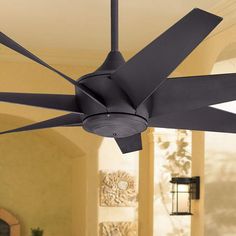 a black ceiling fan in a living room