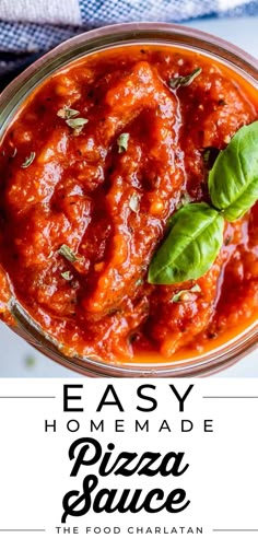 easy homemade pizza sauce in a glass bowl with basil leaves on top and text overlay that reads easy homemade pizza sauce