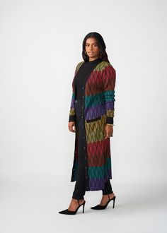 Style#: 7003/P7003 We love versatility and the Aisha African Print Cardigan in Rainbow Diamond Stripes delivers just that. Wear this gorgeous duster-length cardigan sweater open as a layering accent to your outfit of fully buttoned as a statement dress. Features: Contrast color rib knit border and sleeve cuff Can be styled open or closed Regular Length Range: 51-53" Plus Length Range:53 1/2"-54 1/2" Designed in the USA, imported Care Instructions: Hand wash cold. Do not soak. Do not bleach. Lay