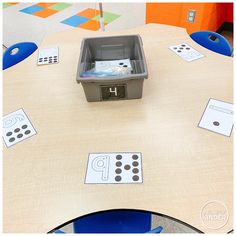 a table with some sort of box on top of it that has different numbers and shapes