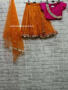 Product: Custom made girl kids dress. Fabric: Lehenga- net and silk with gota work border Top -silk Dupatta - net embroidered Delivery Time : Please keep me informed for any dates or times frame you keeping in mind. Orange Organza Set For Festivals, Traditional Fitted Net Choli, Orange Organza Festival Set, Festival Orange Organza Set, Orange Organza Sharara For Festivals, Anarkali Sets With Net For Navratri, Traditional Orange Organza Sets, Festival Orange Organza Sharara, Festive Net Choli